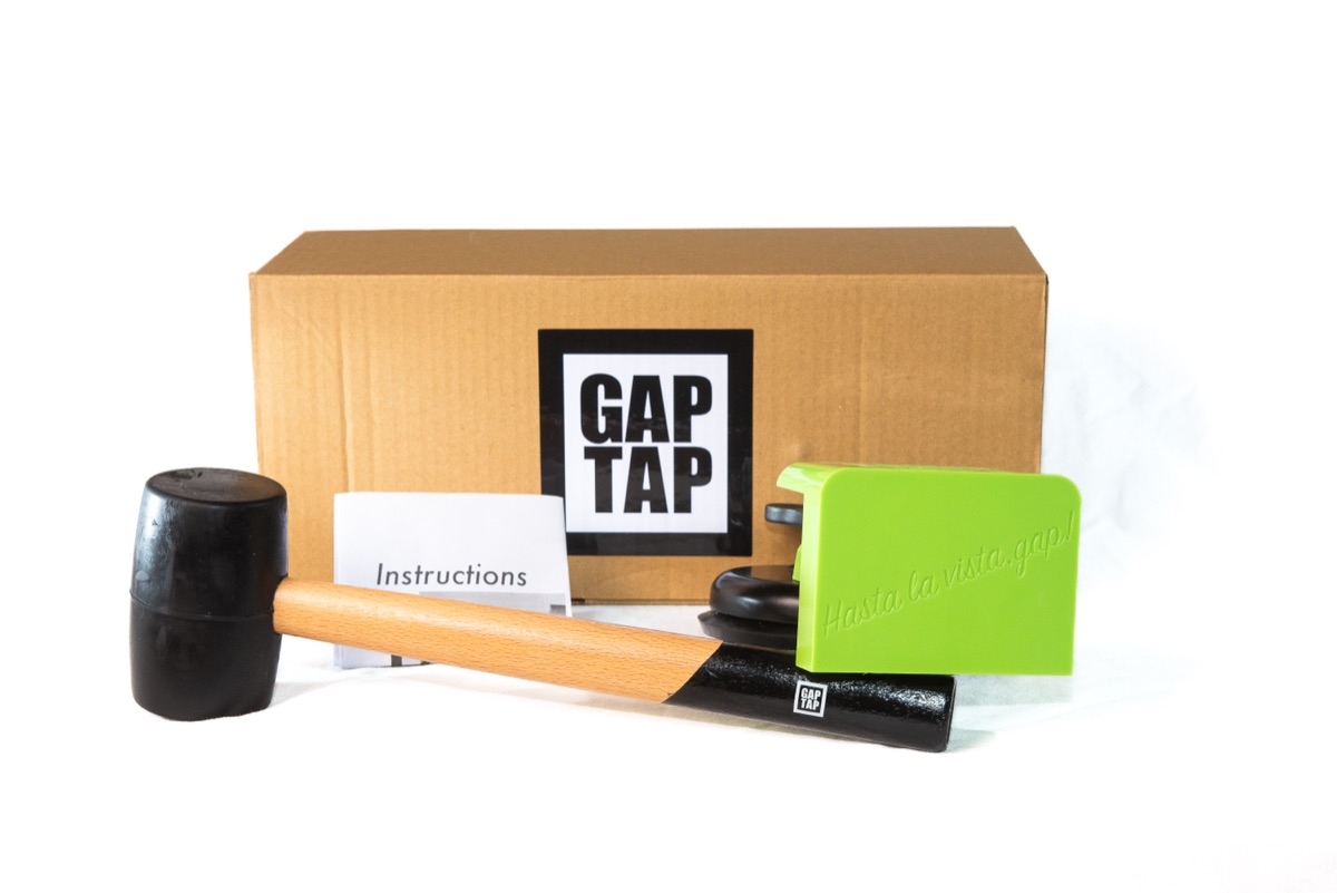 Complete Gap Tap kit — suction cup tool, rubber mallet, protective mat, grease packets, instruction card